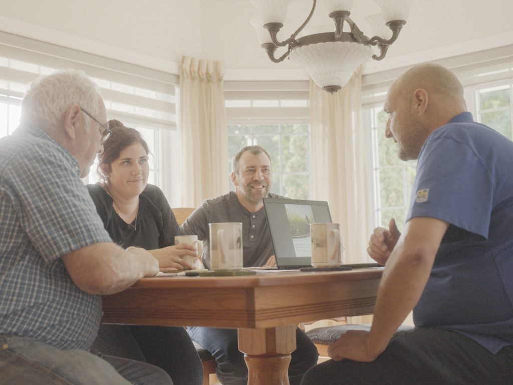 a group of people sitting around a table